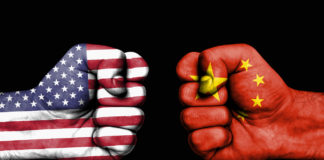Conflict between USA and China - male fists
